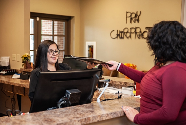 Chiropractic Dalton GA Staff Member Welcoming Patient To Office HP Staff Member Welcoming Patient To Office At Pray Chiropractic