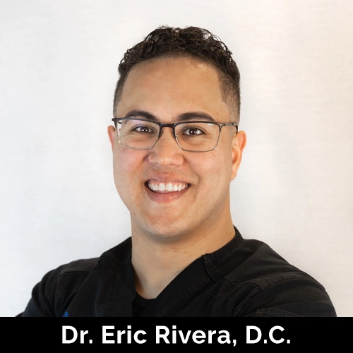 Chiropractor Eric Rivera Smiling In Front Of White Background LP