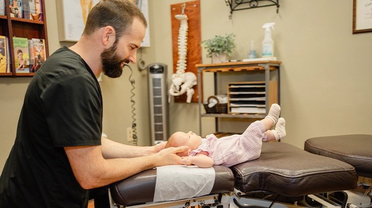 Chiropractor James Bodkin Adjusting Pediatric Patient
